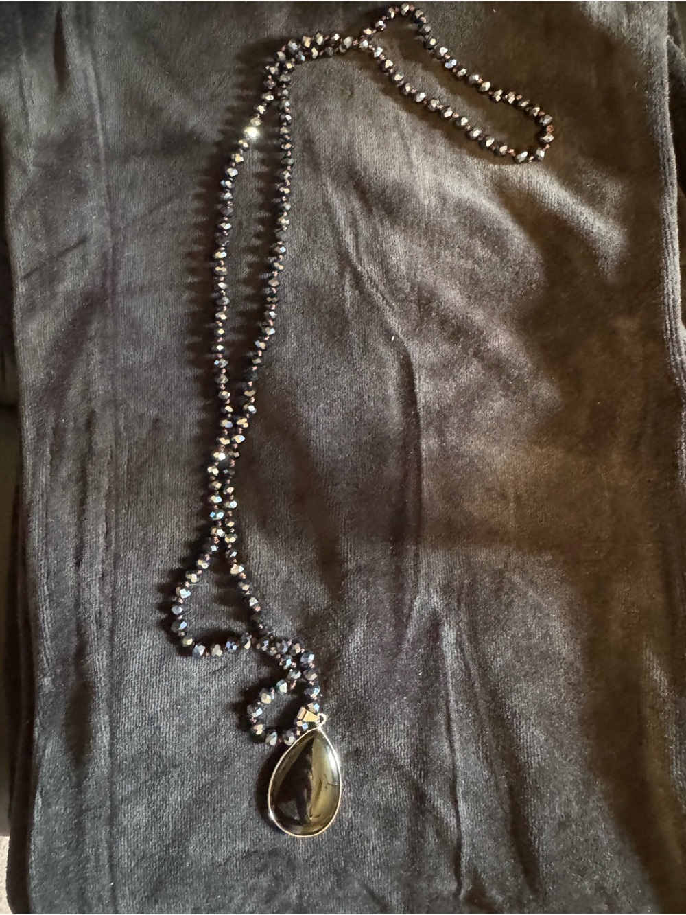 Black beaded stone pendant